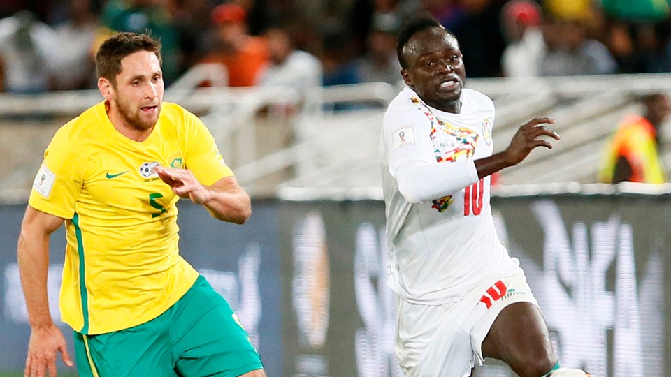 Dean-Furman-L-fights-for-the-ball-with-Senegals-Sadio-Mane