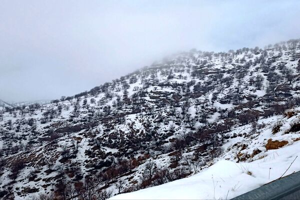 بارش باران و برف زمستانی در روستای کینک