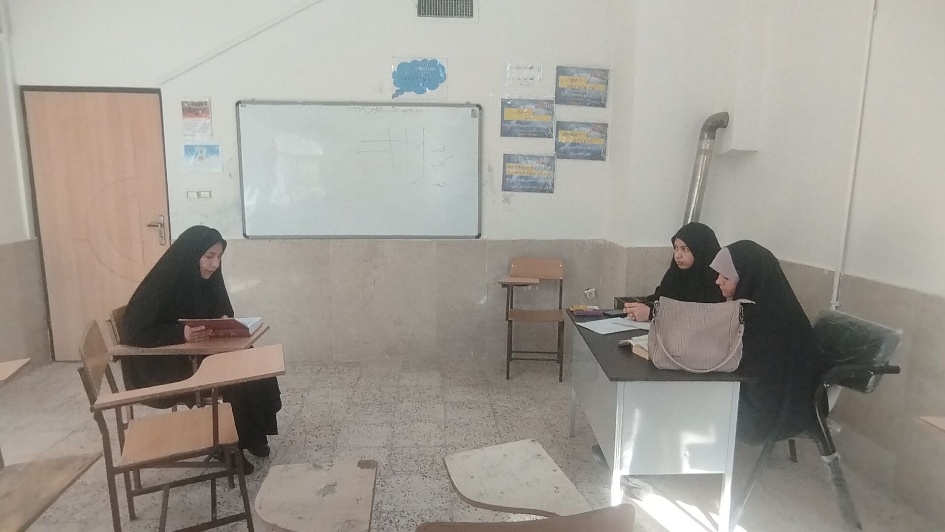 برگزاری آزمون قرآن و عترت در رشته حفظ و قرائت در آشخانه
