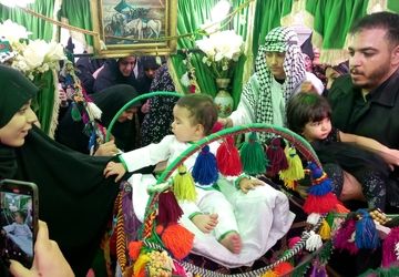 مراسم شیرخوارگان حضرت علی اصغر(ع) در مصلی نماز جمعه شهرستان فلاورجان