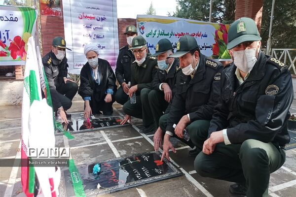 غبارروبی و عطر افشانی گلزار شهدا در گلوگاه