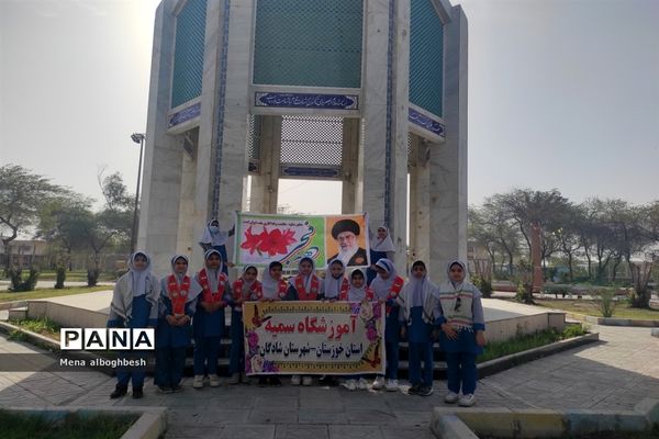 غبارروبی وعطرافشانی مزار شهدای شادگان