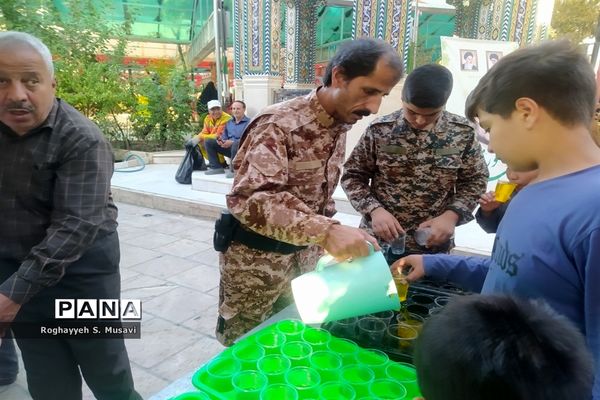 آیین گلباران مزار شهدا به‌مناسبت هفته دفاع مقدس