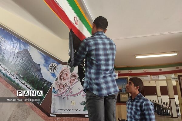 نمایشگاه عکس شهدای عاشورایی و فضاسازی محرم در دبیرستان شهید بهشتی رودهن