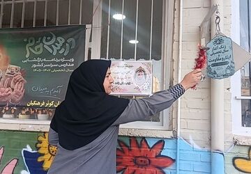 به صدا درآمدن زنگ مهر همزمان با آغاز هفته دفاع مقدس در دبیرستان کوثر فرهنگیان