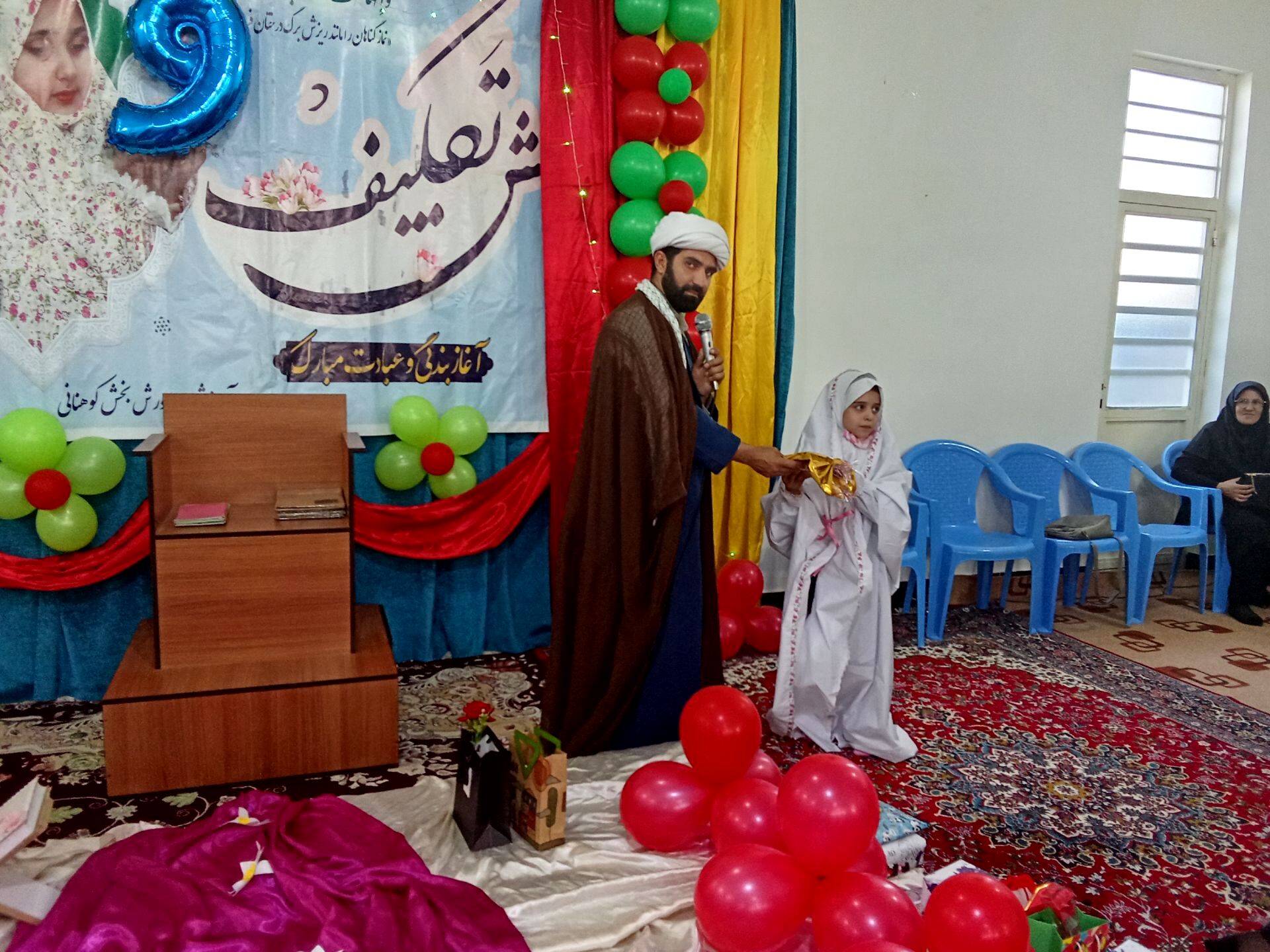 برگزاری مراسم معنوی جشن تکلیف دانش‌آموزان پایه سوم در حسینیه منطقه کوهنانی 