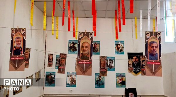 نمایشگاه تصاویر شهدای جنگ رمضان در روستای مومن آباد قم