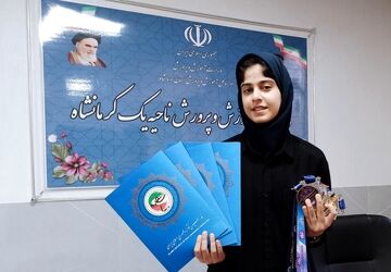تجلیل از دانش‌آموز قهرمان برتر کشور در ناحیه یک کرمانشاه