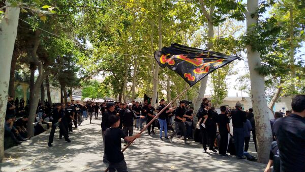 عزاداری ظهر  عاشورا در خیابان‌های شهر نیشابور 