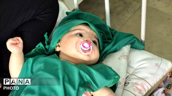 آیین شیرخوارگان حسینی با حضور همسران شهدا در قم